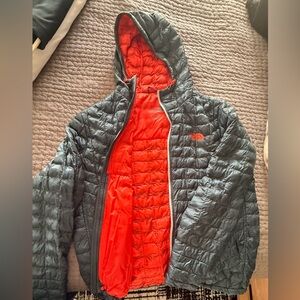 The North Face teal and orange puffer Jacket with 100% down filled